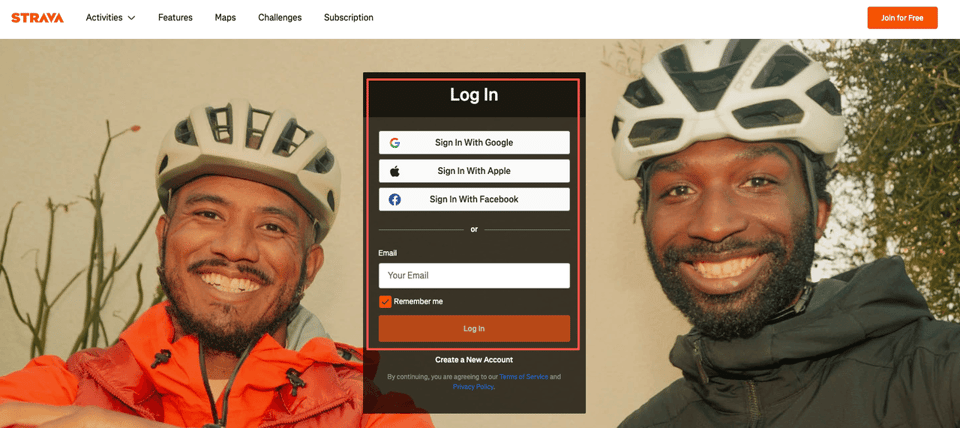 Strava login page showing options to sign in with Google, Apple, or Facebook, set against a background of smiling cyclists.